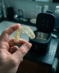 Cloudy, yellowed retainer before cleaning