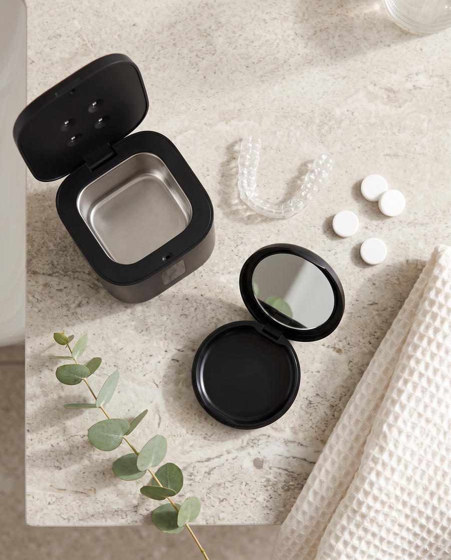 Pod, pocket case, retainer and tablets on a counter