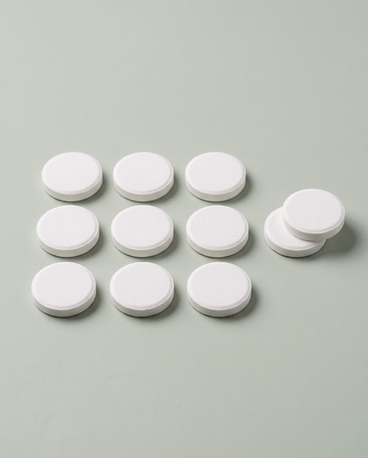 Round white cleaning tablets